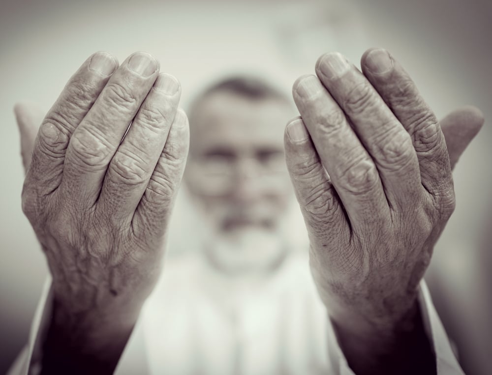 Elderly Muslim Arabic man praying